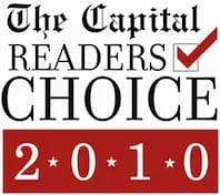 Logo featuring "The Capital Readers Choice 2010" with a red checkmark and red background elements.