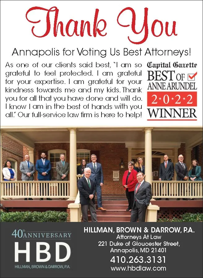 Group photo of attorneys in business attire on porch, with thank you text and law firm contact details.