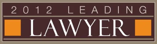 Banner with text "2012 Leading Lawyer" in white and orange on a brown background.